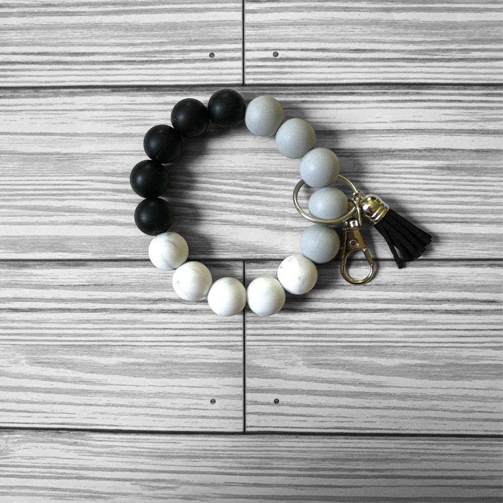 Black, Gray, and White Silicon Wristlet
